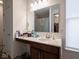 Bright bathroom featuring a modern vanity, stylish mirror, and neutral color palette at 7209 Glen Park Ln, Indianapolis, IN 46259