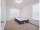 Well-lit bedroom featuring a modern mattress with carpet flooring and two large windows at 7209 Glen Park Ln, Indianapolis, IN 46259