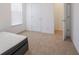 Bright bedroom with carpet, a large window and a view into the hall at 7209 Glen Park Ln, Indianapolis, IN 46259