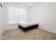 Sunlit bedroom with carpet flooring, large windows, and minimal furnishings at 7209 Glen Park Ln, Indianapolis, IN 46259