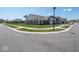 View of home at corner lot with green grass, manicured lawns and a black car parked in driveway at 7209 Glen Park Ln, Indianapolis, IN 46259