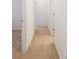 Carpeted hallway with neutral colors and white trim at 7209 Glen Park Ln, Indianapolis, IN 46259