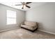 Bedroom featuring a couch, ceiling fan, a window, neutral carpet, and grey walls at 7230 Carrie Dr, Indianapolis, IN 46237