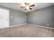 Bedroom featuring a ceiling fan, plush carpet, and neutral walls at 7230 Carrie Dr, Indianapolis, IN 46237