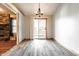 Dining room with wood trim, modern lighting, and sliding door to the backyard at 7230 Carrie Dr, Indianapolis, IN 46237