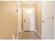 Welcoming entryway featuring neutral paint, tile flooring, and a view of the white front door at 7230 Carrie Dr, Indianapolis, IN 46237
