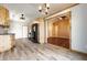 Spacious kitchen featuring wood cabinets, gray floors, and modern appliances at 7230 Carrie Dr, Indianapolis, IN 46237
