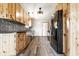 Well-lit kitchen with wood cabinets, decorative backsplash, and stainless steel appliances at 7230 Carrie Dr, Indianapolis, IN 46237