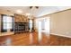Spacious living room showcasing a brick fireplace, hardwood floors, and natural lighting at 7230 Carrie Dr, Indianapolis, IN 46237