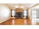 Bright living room boasts hardwood floors and a brick fireplace, perfect for Gathering gatherings at 7230 Carrie Dr, Indianapolis, IN 46237