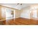 Inviting living room with hardwood floors, open layout, and a view into the kitchen at 7230 Carrie Dr, Indianapolis, IN 46237