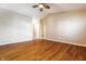 Bright living room featuring hardwood floors, neutral walls, and a ceiling fan at 7230 Carrie Dr, Indianapolis, IN 46237