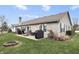 Expansive backyard featuring a fire pit, patio, and well-maintained lawn at 7441 Sugar Pine Ct, Avon, IN 46123