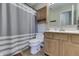 Well-maintained bathroom featuring a shower-tub combo, vanity, and storage cabinet at 7441 Sugar Pine Ct, Avon, IN 46123