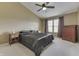 Bedroom features a ceiling fan, neutral-toned walls, and natural light at 7441 Sugar Pine Ct, Avon, IN 46123