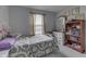 Comfortable bedroom with vintage decorations and a bookshelf for storage at 7441 Sugar Pine Ct, Avon, IN 46123