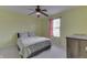 Bright bedroom featuring a ceiling fan, comfortable bed, and natural light at 7441 Sugar Pine Ct, Avon, IN 46123