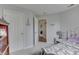 Clean bedroom featuring a closet, nightstand and grey walls at 7441 Sugar Pine Ct, Avon, IN 46123