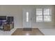 Bright foyer with a white front door with decorative glass, complemented by a neutral color scheme at 7441 Sugar Pine Ct, Avon, IN 46123