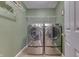 Bright laundry room features a washer and dryer with overhead storage at 7441 Sugar Pine Ct, Avon, IN 46123