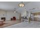 An open floor plan in the living room with a fireplace, and bar seating that leads to the kitchen at 7441 Sugar Pine Ct, Avon, IN 46123