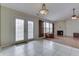 A well-lit living room features a fireplace and French doors with lots of natural light at 7441 Sugar Pine Ct, Avon, IN 46123