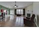 Bright open floor plan in the living room that features a fireplace, a fan, and outside access at 7441 Sugar Pine Ct, Avon, IN 46123