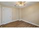 A cozy room with a ceiling fan and natural light offers comfort and functionality at 844 Blanchard St, Shelbyville, IN 46176