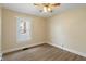 Bright bedroom with a ceiling fan and window offers comfort and natural light at 844 Blanchard St, Shelbyville, IN 46176
