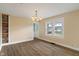 Dining room featuring a classic chandelier, brick shelf and modern wood flooring at 844 Blanchard St, Shelbyville, IN 46176