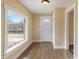 Inviting foyer featuring wood floors and a bright front window at 844 Blanchard St, Shelbyville, IN 46176