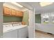 Functional laundry room with washer, dryer and cabinets offers convenience at 844 Blanchard St, Shelbyville, IN 46176