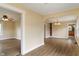 Open living space with wood floors, arched doorway, and neutral wall colors at 844 Blanchard St, Shelbyville, IN 46176
