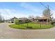The backyard has a well-maintained lawn with a detached garage and a view of other properties at 844 Blanchard St, Shelbyville, IN 46176