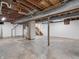 Spacious unfinished basement with concrete floor, exposed ceiling, and access to stairs at 87 S 10Th Ave, Beech Grove, IN 46107