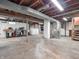Unfinished basement space featuring exposed ductwork, laundry area, and sturdy support beams at 87 S 10Th Ave, Beech Grove, IN 46107