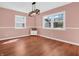 Bright and airy dining room features laminate floors, a wooden cabinet, and large windows at 87 S 10Th Ave, Beech Grove, IN 46107