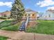 Charming home with a well-maintained lawn, tall tree, and inviting front entrance with stairs at 87 S 10Th Ave, Beech Grove, IN 46107