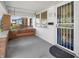 Inviting front porch featuring a cozy porch swing and secure screen door at 87 S 10Th Ave, Beech Grove, IN 46107
