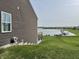 Lakeside backyard with a window and a hose, and docks in the distance at 8755 Stoddard Ln, Indianapolis, IN 46217