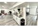 Basement bar with a granite countertop, with an open floor plan including living and play areas at 8755 Stoddard Ln, Indianapolis, IN 46217