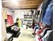 Unfinished basement provides ample storage, customizable shelving, and exposed ceiling beams at 8755 Stoddard Ln, Indianapolis, IN 46217