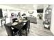 Open basement featuring dining area, play area, and entertaining space with stylish flooring at 8755 Stoddard Ln, Indianapolis, IN 46217