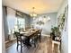 Cozy dining room featuring a wooden table set for dinner and beautiful decor at 8755 Stoddard Ln, Indianapolis, IN 46217