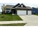 Charming single Gathering home with a two-car garage, well maintained lawn, and inviting front porch at 8755 Stoddard Ln, Indianapolis, IN 46217