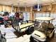 Organized garage featuring ample storage, a utility trailer, and golf cart for recreational activities at 8755 Stoddard Ln, Indianapolis, IN 46217