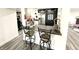 Open floor plan with a bar, stainless steel appliances, and ample counter space, great for entertaining at 8755 Stoddard Ln, Indianapolis, IN 46217