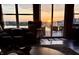Living room with sunset water views, comfortable seating and access to outdoor patio at 8755 Stoddard Ln, Indianapolis, IN 46217