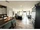 Open concept living room and kitchen with hardwood floors, modern furnishings, and plenty of natural light at 8755 Stoddard Ln, Indianapolis, IN 46217