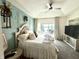 Main bedroom with water views, stylish decor, and access to private balcony at 8755 Stoddard Ln, Indianapolis, IN 46217